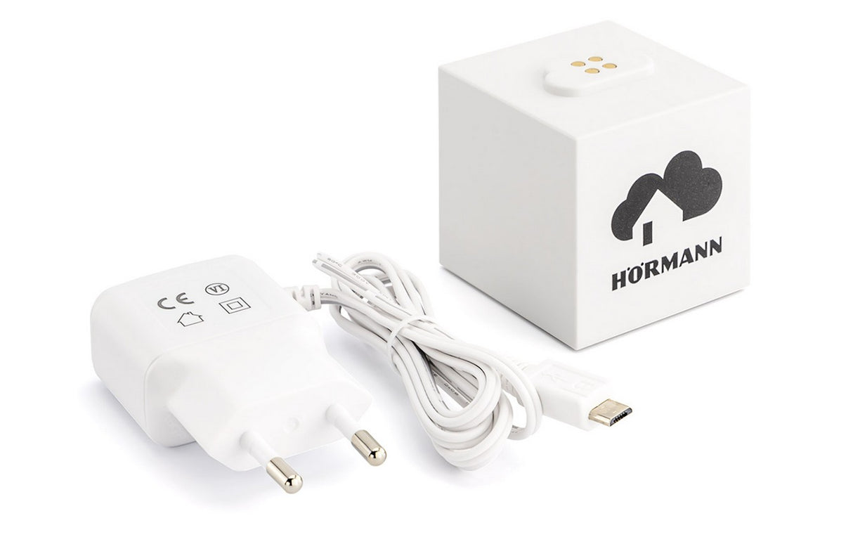Hörmann homee Brain 4510463, kostka bazowa smart home, widok urządzenia z zasilaczem sieciowym